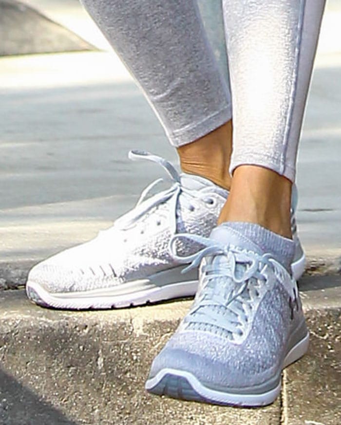 Alessandra Ambrosio completed her gym-ready outfit with pale gray Under Armour Threadborne Fortis 3 running shoes featuring lightweight knit uppers and cushioned athletic soles