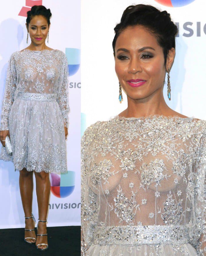 Jada Pinkett Smith's knee-length embellished dress puts her metallic three-strap sandals on full display, while pink lipstick and blue-accented earrings add color to the silver palette
