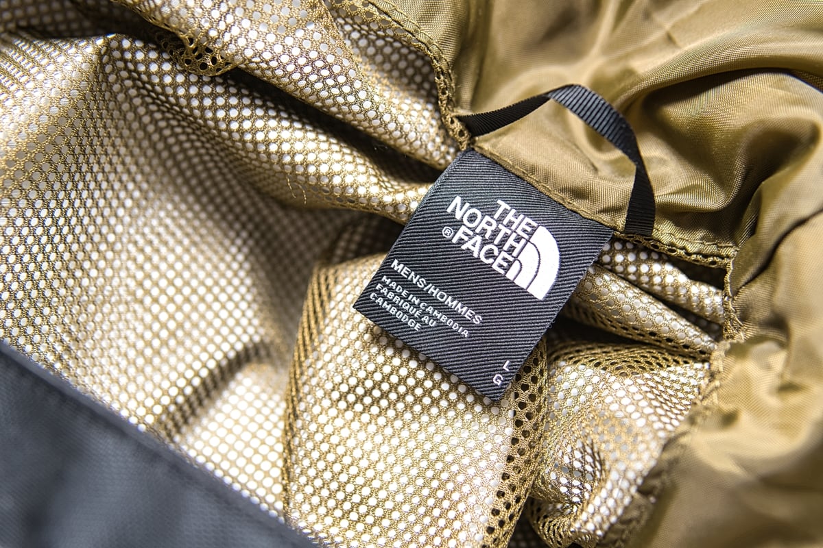 Close-up of an authentic The North Face label, displaying product details and country of manufacture for verification