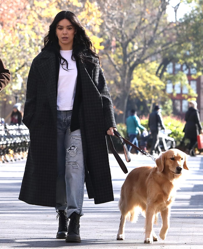 Hailee Steinfeld pairs a Proenza Schouler White Label plaid coat and ripped Balenciaga jeans with black Dr. Martens 1490 boots