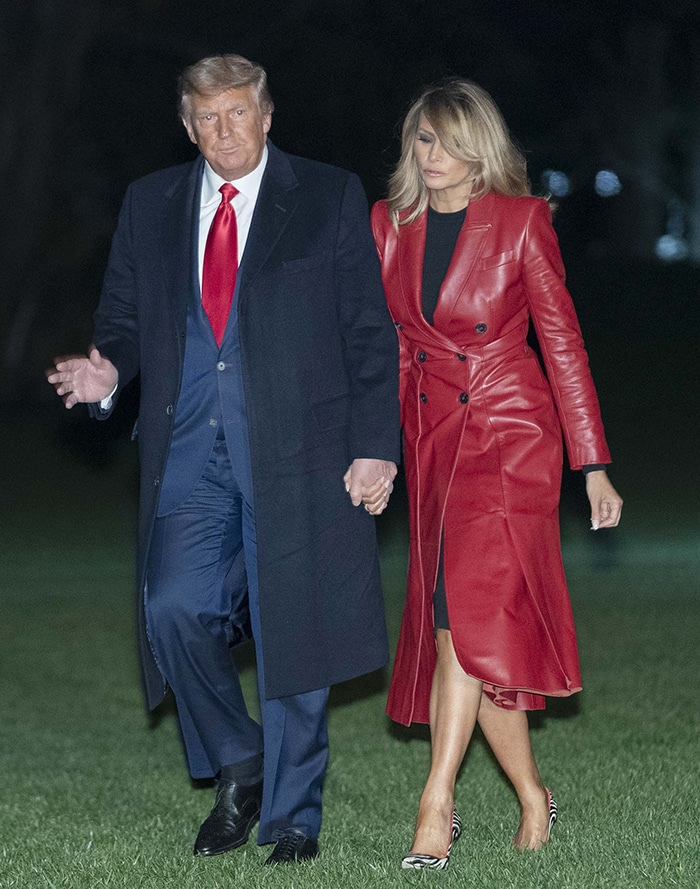 Melania Trump makes a bold winter statement in a red leather Alexander McQueen coat, pairing the striking outerwear with zebra-print Manolo Blahnik BB pumps