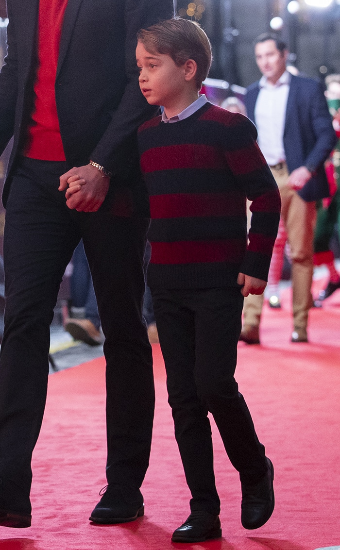 Prince George wears a Ralph Lauren striped sweater with dark jeans and black leather shoes