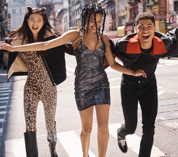 A trio of friends stride through the city in trend-forward looks—from a sleek sequin mini to bold leopard print—capturing the playful, high-energy style HM delivers for teens and young adults