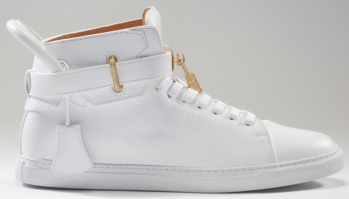 The Buscemi 100MM Diamond, released in 2016, is crafted from white tumbled leather and elevated with 11.50 carats of diamonds set in 18-karat gold hardware—retailing at $132,000 as one of the most luxurious sneakers ever made
