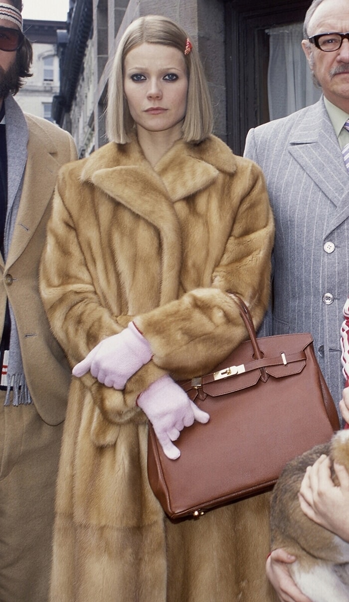 Gwyneth Paltrow as Margot Tenenbaum wearing a long Fendi fur coat and carrying a Hermès Birkin bag in The Royal Tenenbaums