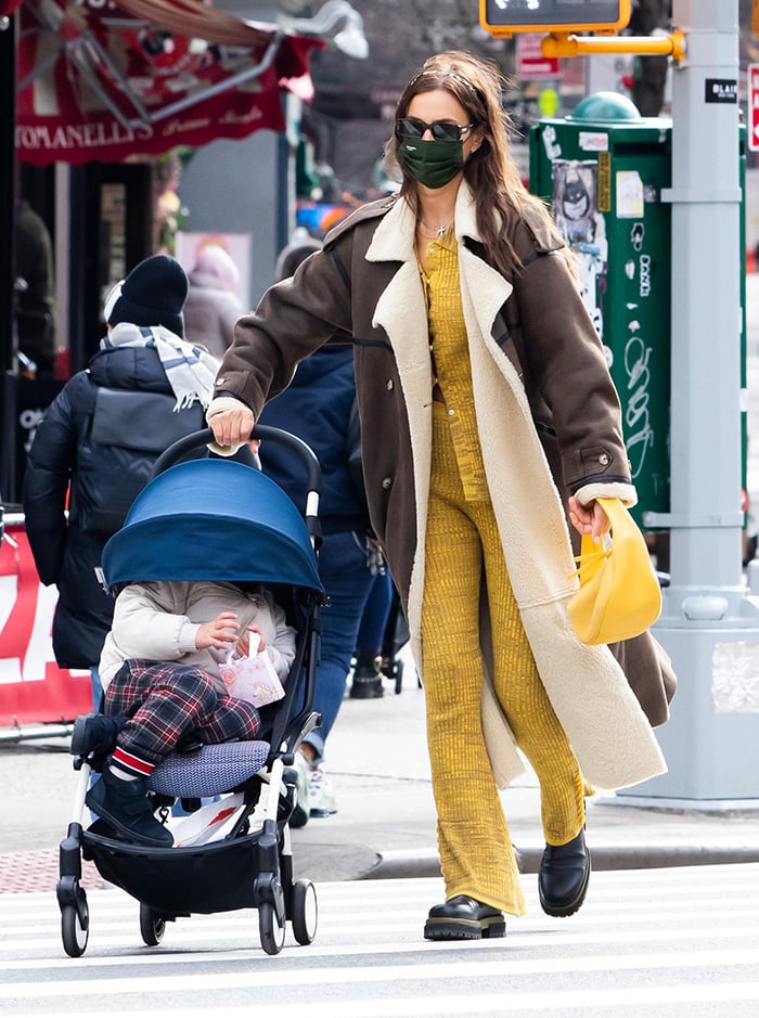 Crossing the street in Manhattan, Shayk sharpens her off-duty uniform with structured outerwear and elevated flatform boots that add subtle height without sacrificing stability