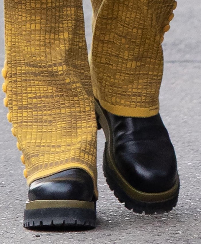 The Maria Luca Acacia Chelsea boots feature smooth black calfskin, elastic side panels, and a thick olive-toned flatform sole designed for grip and durability on city pavement