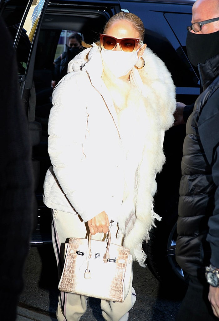 Jennifer Lopez carries one of the rarest Hermès Birkin Himalaya Blanc crocodile bags