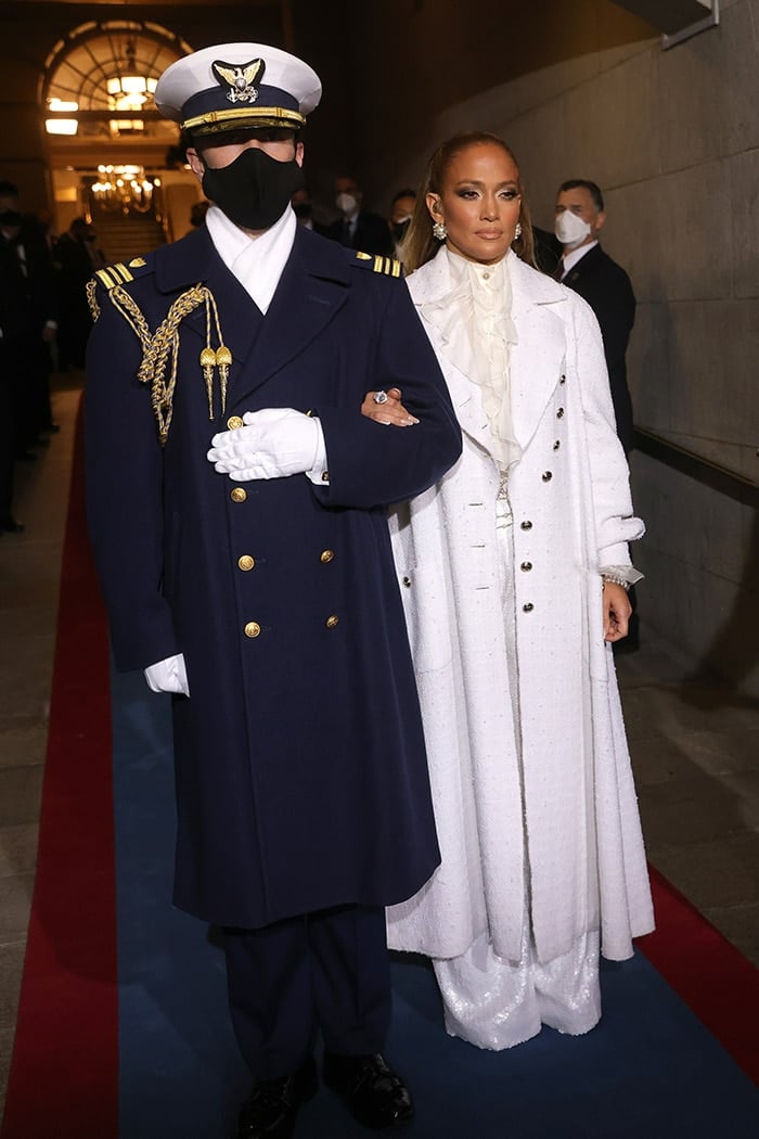 Jennifer Lopez dons a sheer white Chanel blouse with a Chanel Fall 2020 overcoat