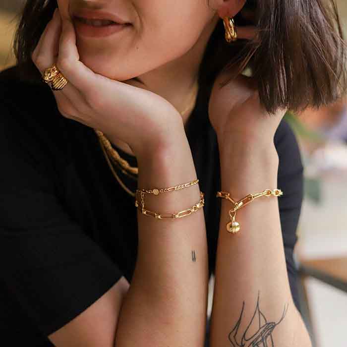 Stack the Gold Aegis and Filla Chain bracelets for a classier look