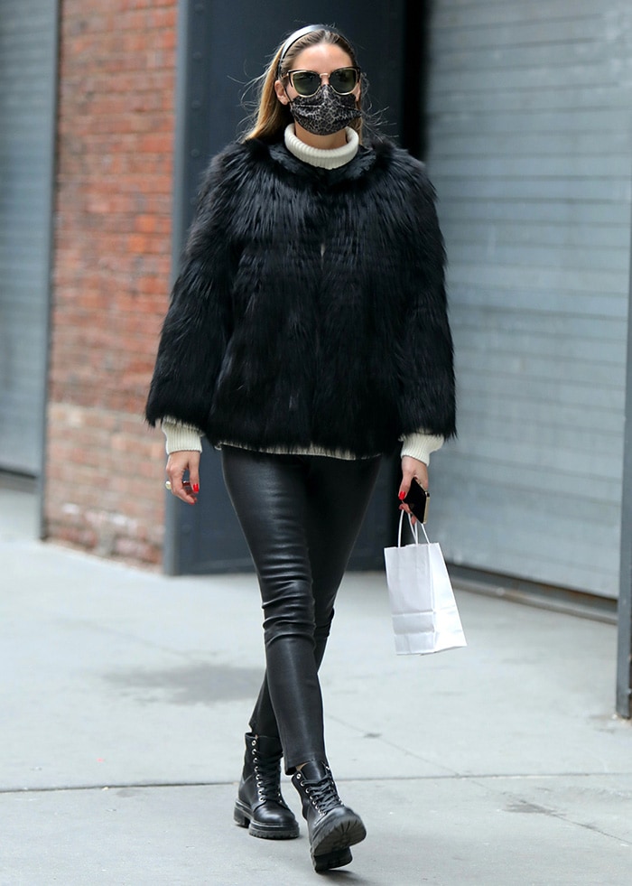 Olivia Palermo pairing a shaggy black Pologeorgis fur jacket with leather-look leggings and black Gianvito Rossi combat boots for a streamlined cold-weather look