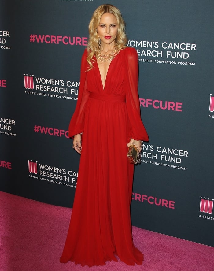 Rachel Zoe wears a red V-neck dress with long sleeves at the Women's Cancer Research Fund's 'An Unforgettable Evening'