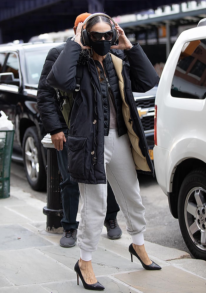 Sarah Jessica Parker wears layered winter jackets outside her SJP Collection store at South Street Seaport