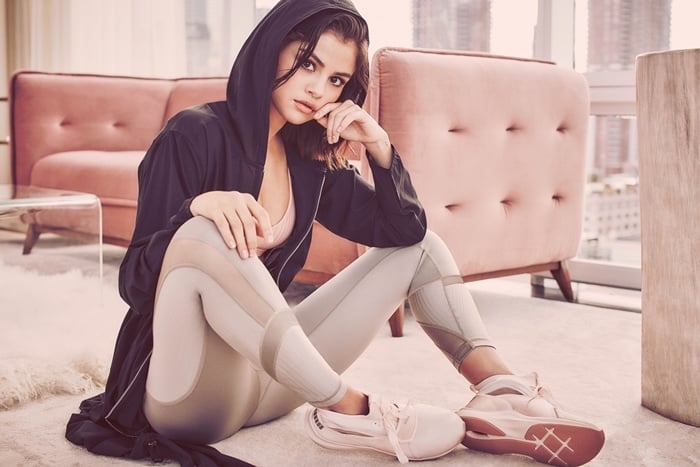 Selena Gomez models athletic Puma sneakers inspired by ballet flats — blending performance design with feminine elegance