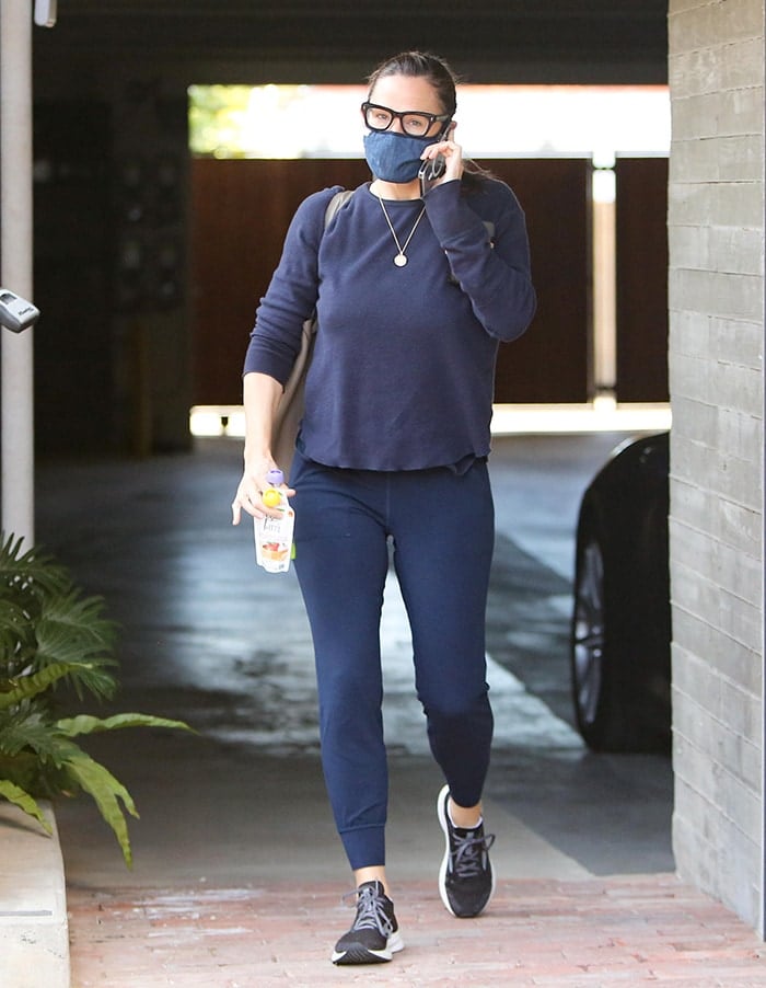 Jennifer Garner visits her Brentwood home construction site on January 13, 2021, pairing Alo Yoga leggings with cushioned Brooks performance sneakers for a streamlined athleisure look