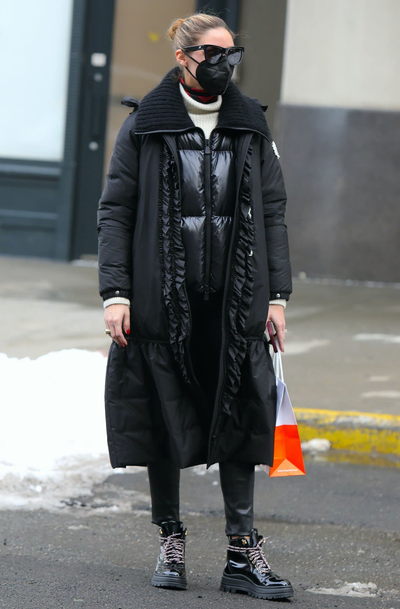 Olivia Palermo layers a Moncler Genius x Simone Rocha padded coat over textured knitwear, finishing the snow-ready look with glossy Fratelli Rossetti patent lace-up boots