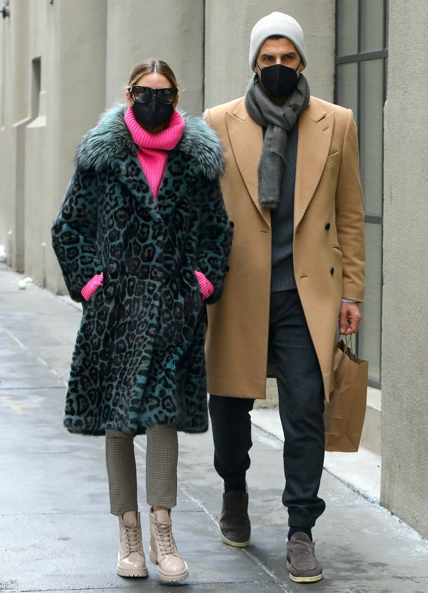 Olivia Palermo anchors a vivid Cara Mila leopard coat and pink turtleneck with beige Gianvito Rossi “Martis” patent combat boots while walking with Johannes Huebl