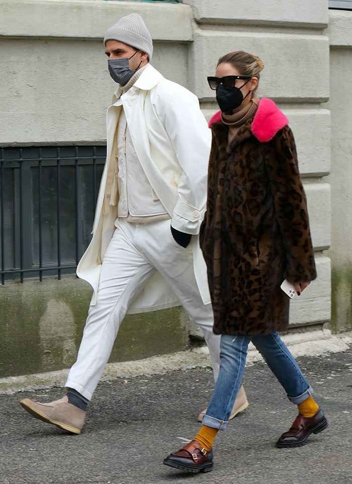 Olivia Palermo pairs a leopard-print Cara Mila coat with rolled-cuff jeans, mustard socks, and chunky Santoni double-monk loafers while out for lunch with Johannes Huebl