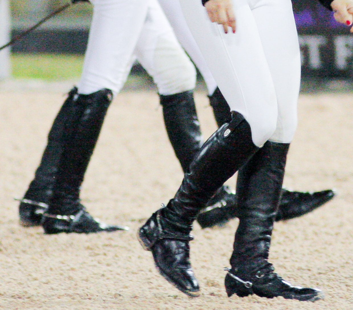Riders stride confidently in classic black field boots designed for both form and function