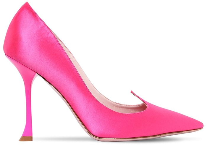 Roger Vivier's "Love Vivi" satin pumps in vibrant fuchsia feature elegant pointed toes and the collection's signature sculptural curved heels