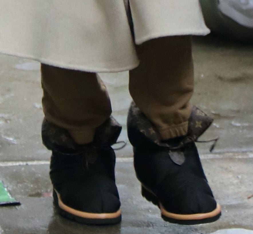 A closer look at Selena’s Louis Vuitton Pillow Comfort ankle boots reveals the monogrammed lining and nylon texture that make them both practical and fashion-forward for a winter shoot