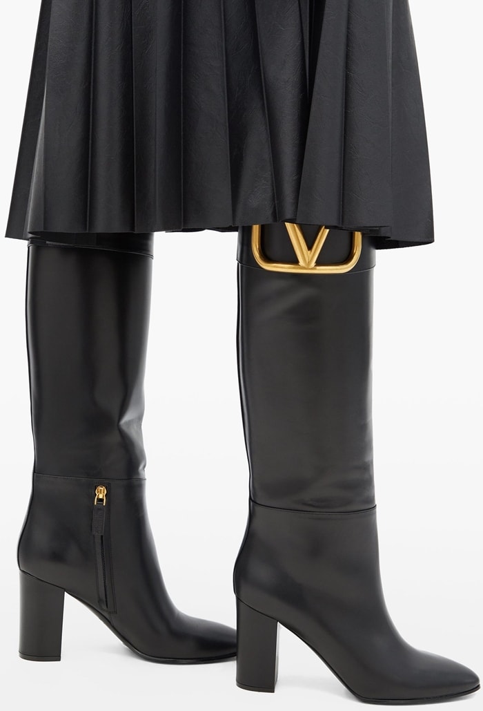 Valentino Garavani’s black Supervee boots are crafted in Italy from butter-soft leather to a knee-high profile that rests on a block heel