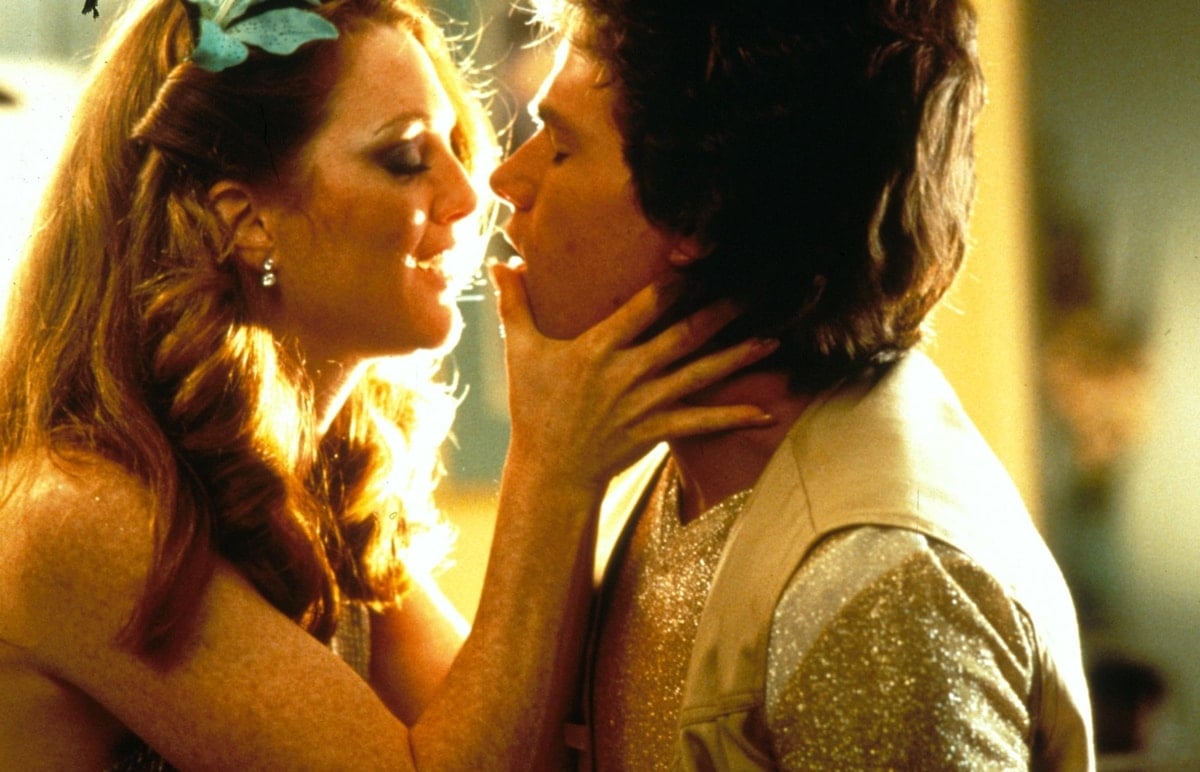 Julianne Moore and Mark Wahlberg portray Amber Waves and Dirk Diggler in Boogie Nights, a bold exploration of the 1970s adult film industry and the complex relationships behind the scenes
