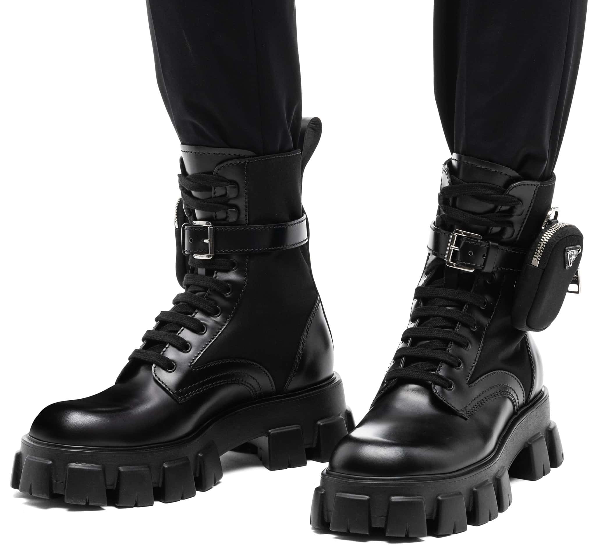 The Prada brushed leather and technical fabric boots are characterized by the removable pouch and have oversized light rubber sawtooth soles
