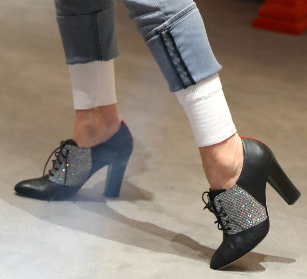 Sarah Jessica Parker slips into her SJP Collection “Chaucer” heeled oxford pumps, featuring sparkling crystal-embellished lace-up vamps and sleek almond toes
