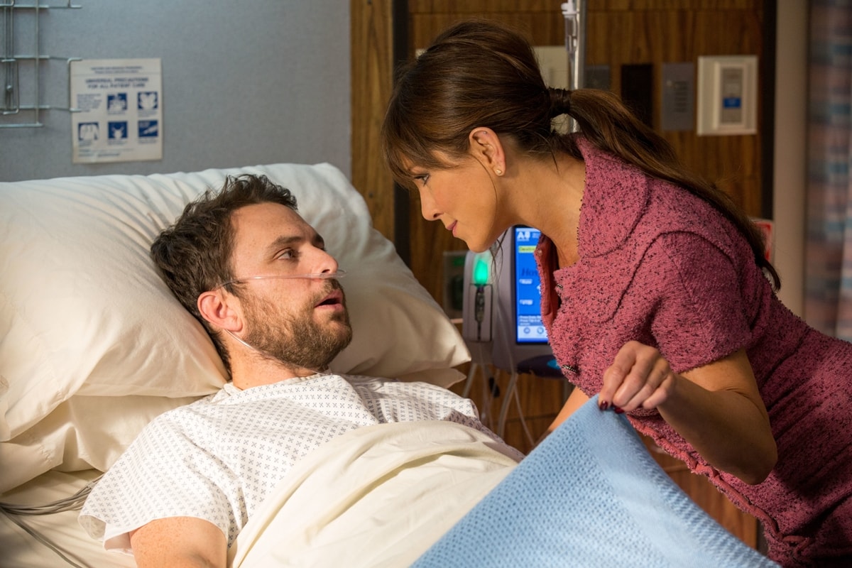 Jennifer Aniston leans in as Dr. Julia Harris in Horrible Bosses 2, confronting a dazed Charlie Day's Dale Arbus in a scene layered with dark humor and controversy