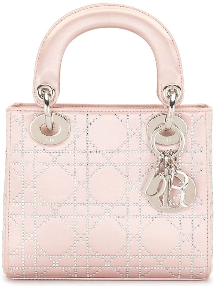 The pink satin mini Lady Dior Cannage bag features the unique and charming Cannage quilt, inspired by Napoléon II Cannage chairs