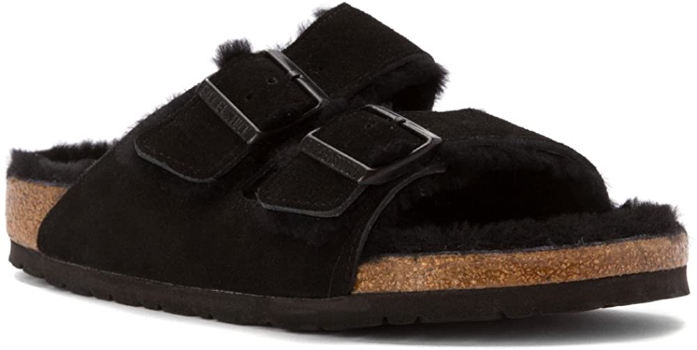 The classic Birkenstock Arizona sandals get a cozy upgrade with soft tonal shearling trims and the brand’s signature cork-latex footbed