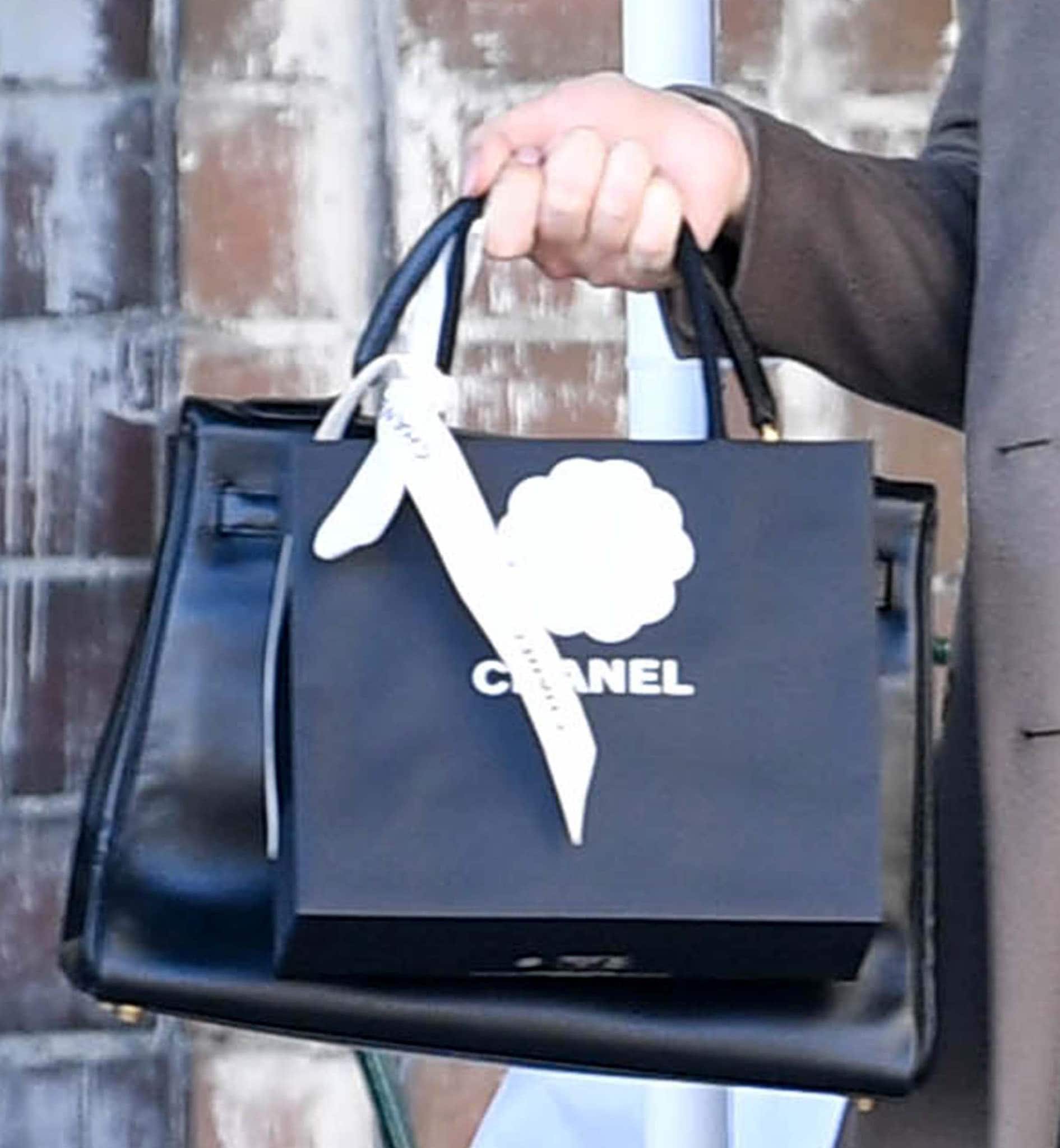 Kelly Osbourne carries a sleek black Chanel shopping bag during a solo outing in Los Angeles