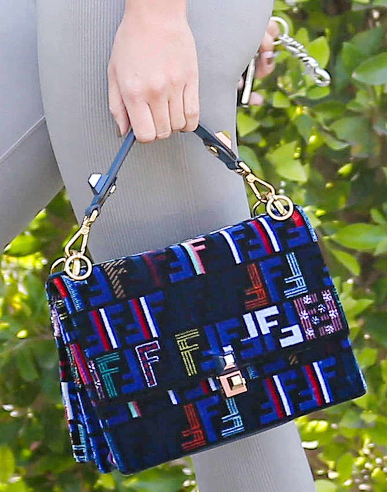 Rather than carrying a typical gym tote, Richie elevated the athleisure look with a colorful Fendi Kan I Tappetino shoulder bag featuring the Italian house's signature FF motif