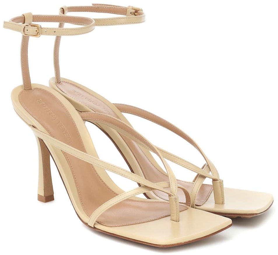 A minimalist pair of Bottega Veneta sandals with trendy square toes and sculpted heels