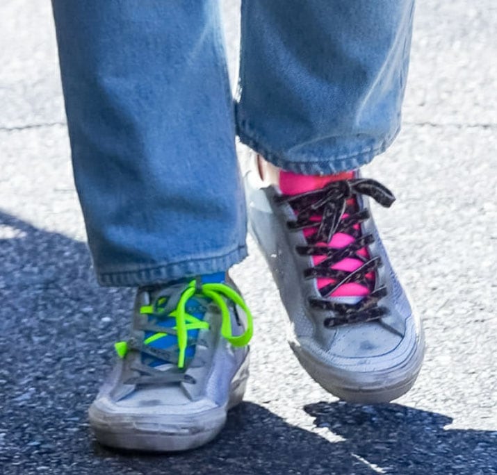 A close-up reveals the contrasting neon green and hot-pink laces on Hilary Duff’s Golden Goose “Twenty” sneakers, one of only 400 numbered pairs produced