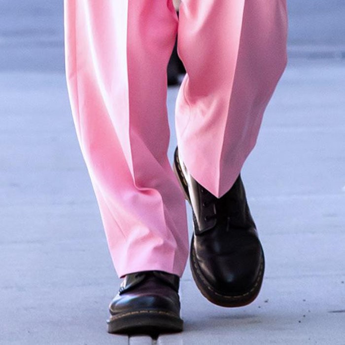 Irina Shayk completes a black-and-pink boss-lady look with Dr. Martens 1460 boots