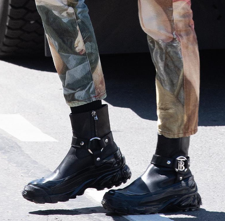 Adding edge to her painted denim co-ords, Irina Shayk steps out in Burberry’s Monogram Motif buckle boots, defined by their rain-boot-inspired overshoe and bold silver-tone initials