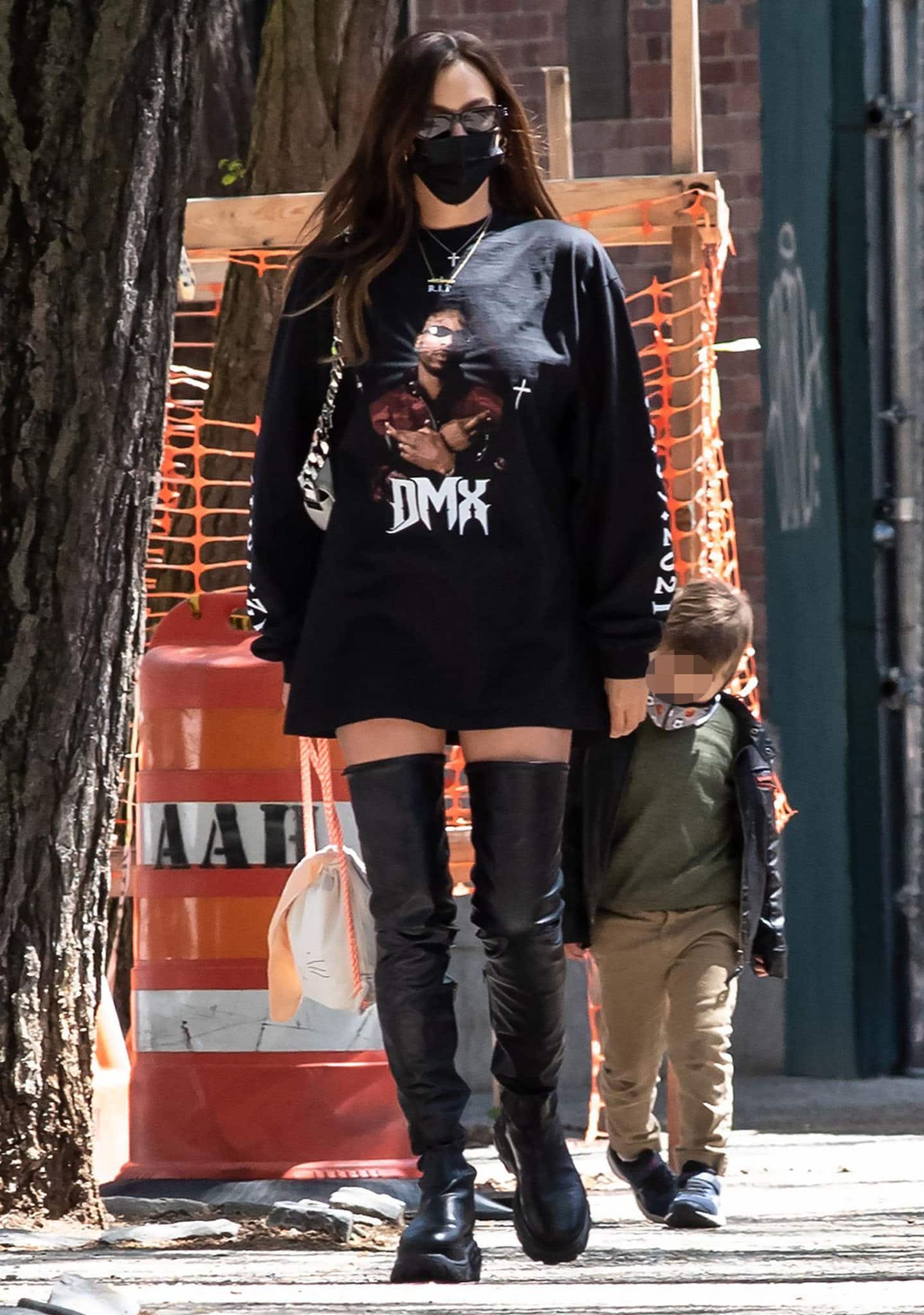 Irina Shayk goes rock-chic in a DMX tribute sweatshirt paired with thigh-high 032C leather sneaker boots as she picks her daughter up from school on April 26, 2021