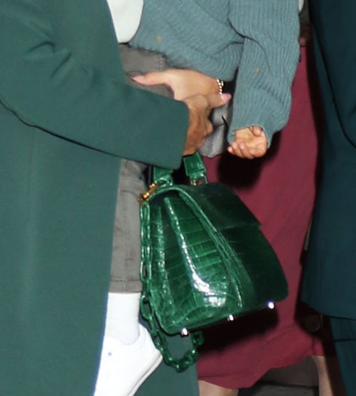 Jessica Alba completed her monochromatic IPO look with a glossy Nancy Gonzalez Lexi crocodile top-handle bag in rich Kelly green