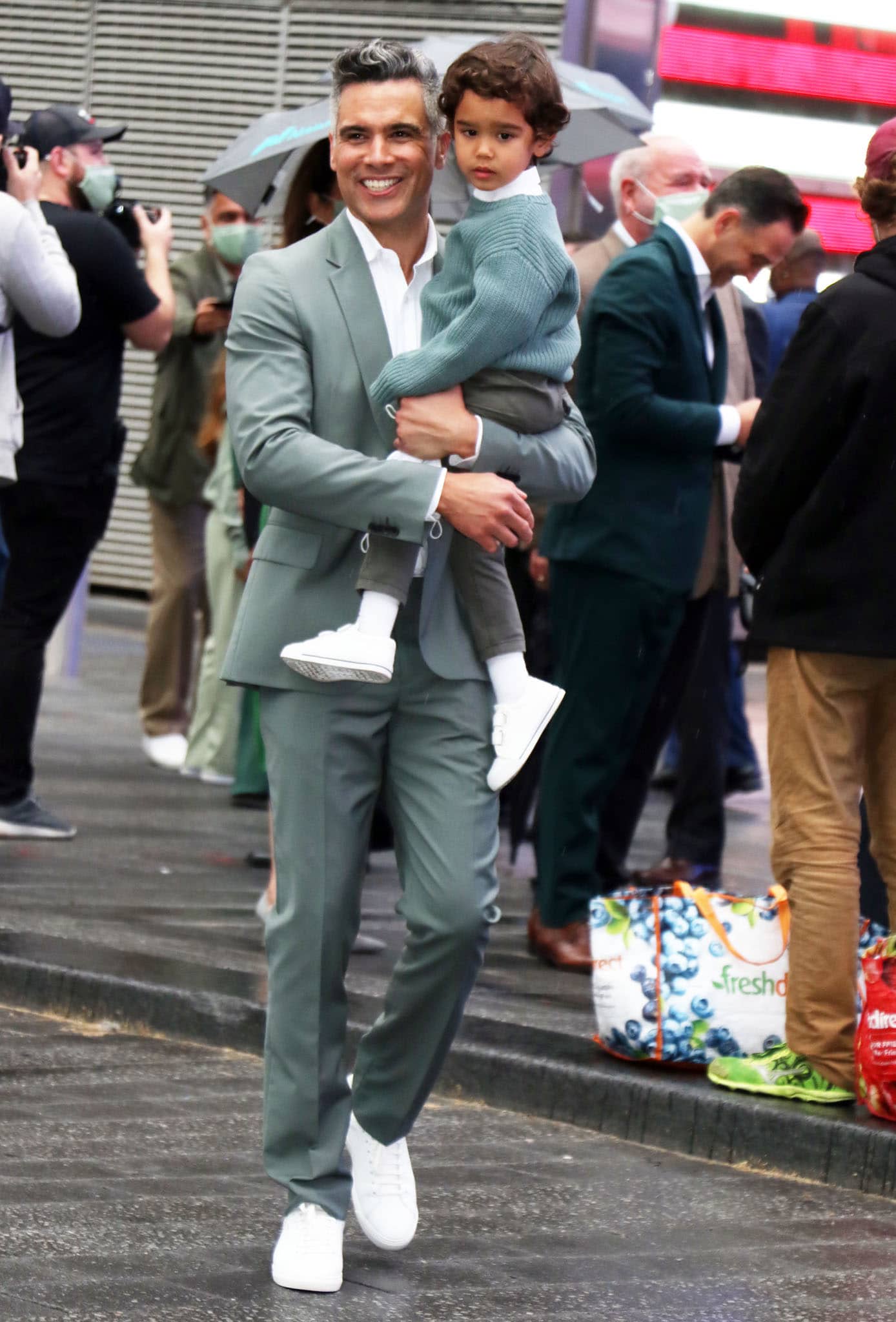 Cash Warren and son Hayes arrived in soft green tones and crisp white sneakers to support Jessica Alba during The Honest Company’s milestone Nasdaq opening bell ceremony