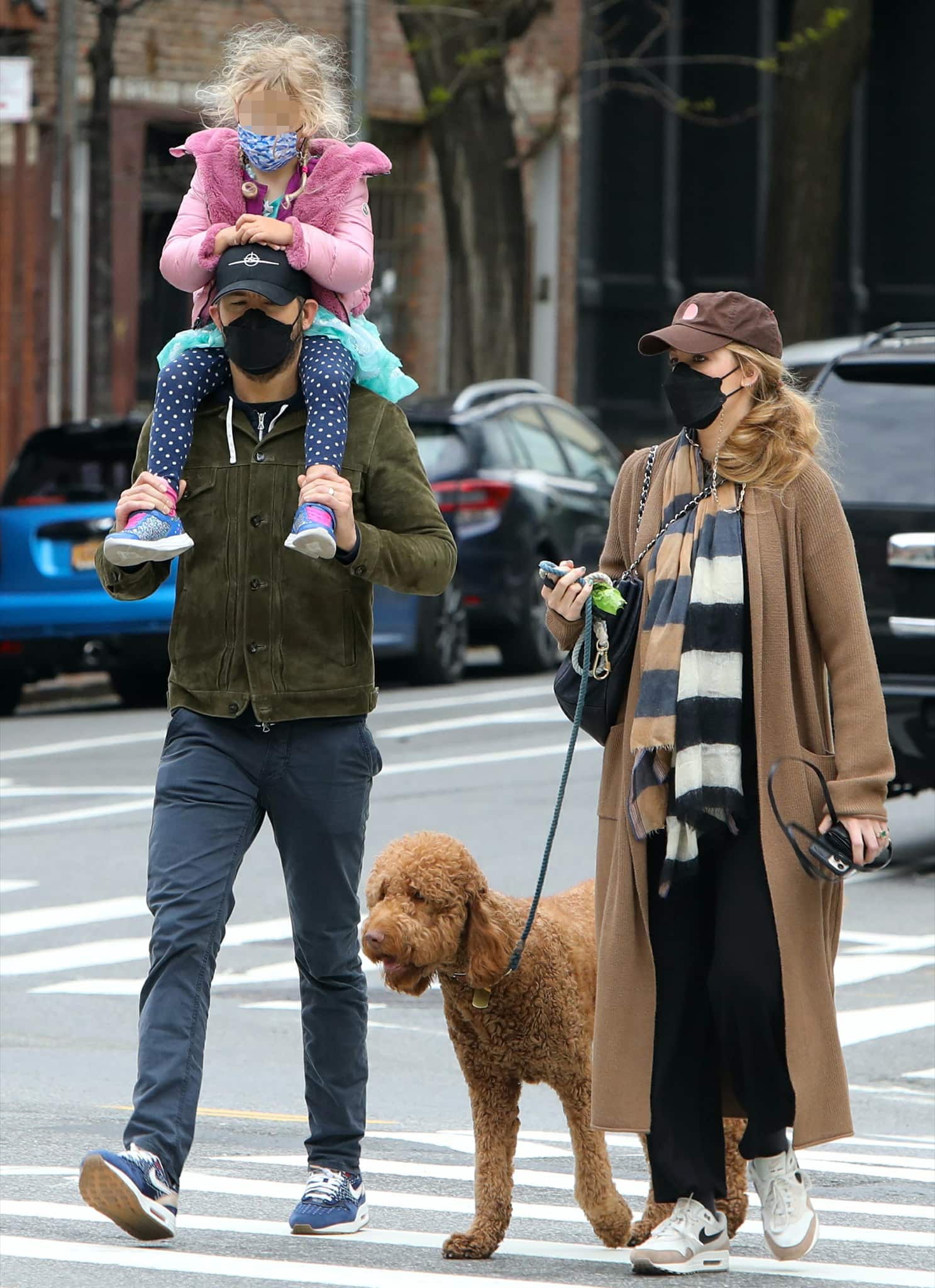 Ryan Reynolds and Blake Lively take daughter Inez and the family dog for a walk in New York City on April 28, 2021, with Blake wearing Nike Air Max 1 "Desert Sand" sneakers and Ryan sporting blue Nike Air Max trainers