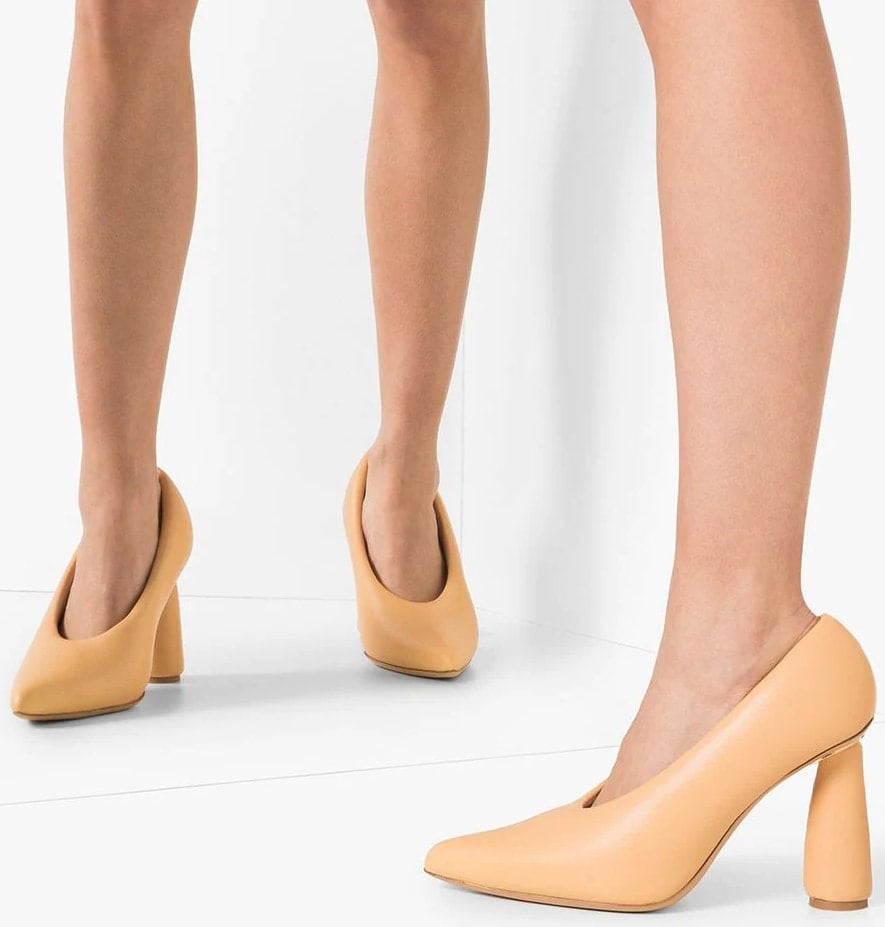 Jacquemus beige leather slip-on pumps feature sculptural cone heels, blending modern elegance with bold architectural design