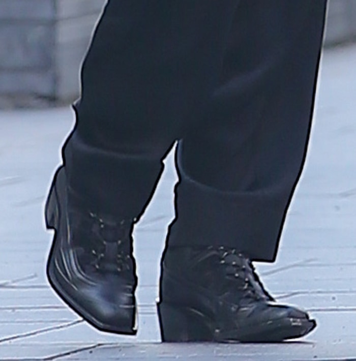Burberry's Futura Archive derby shoes introduced a tailored counterpoint to Irina Shayk's utilitarian jumpsuit, combining technical fabric panels with an elongated silhouette and modest block heel
