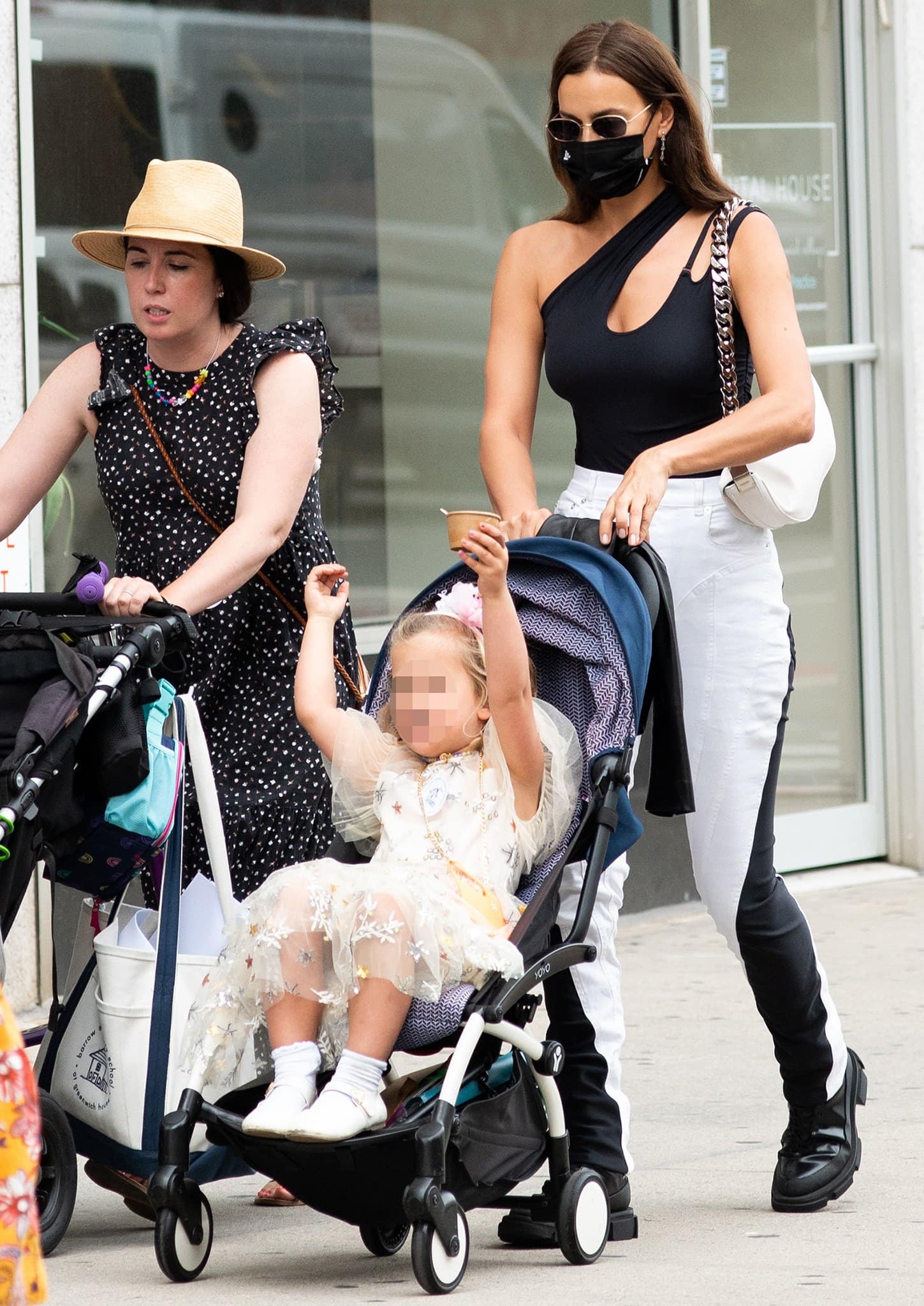 Irina Shayk pairs Mugler's sculptural bodysuit and signature spiral-panel pants with chunky Both Gao combat boots for a striking black-and-white street-style look
