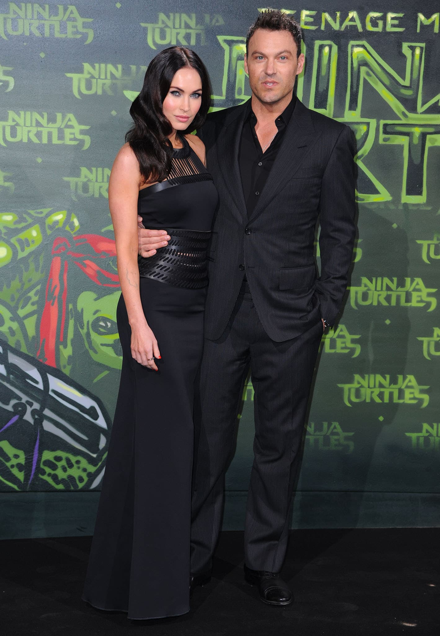 Megan Fox stuns in a sculpted David Koma gown paired with Brian Atwood “Tribeca” sandals alongside Brian Austin Green at the Teenage Mutant Ninja Turtles German premiere on October 5, 2014