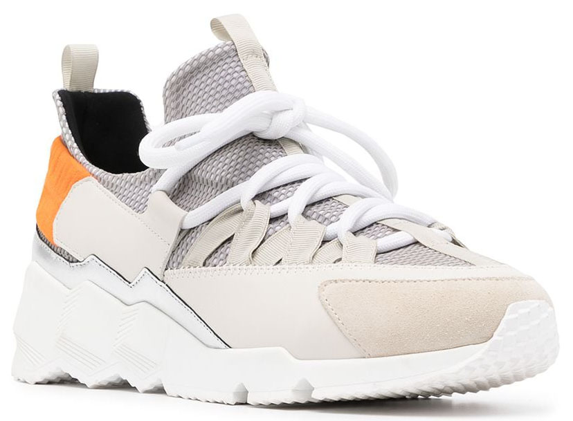 The Pierre Hardy Trek Comet features contrasting panels in beige and gray with a pop of orange at the rear and a chunky ridged sole
