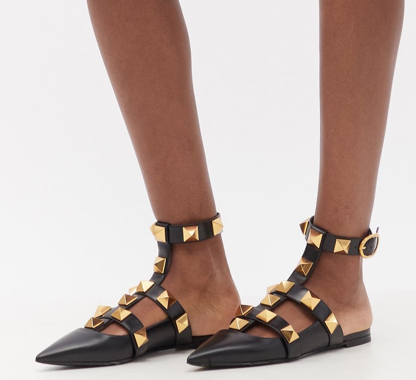 These Valentino Garavani flats are decorated with large Rockstuds and have ankle straps and a backless silhouette