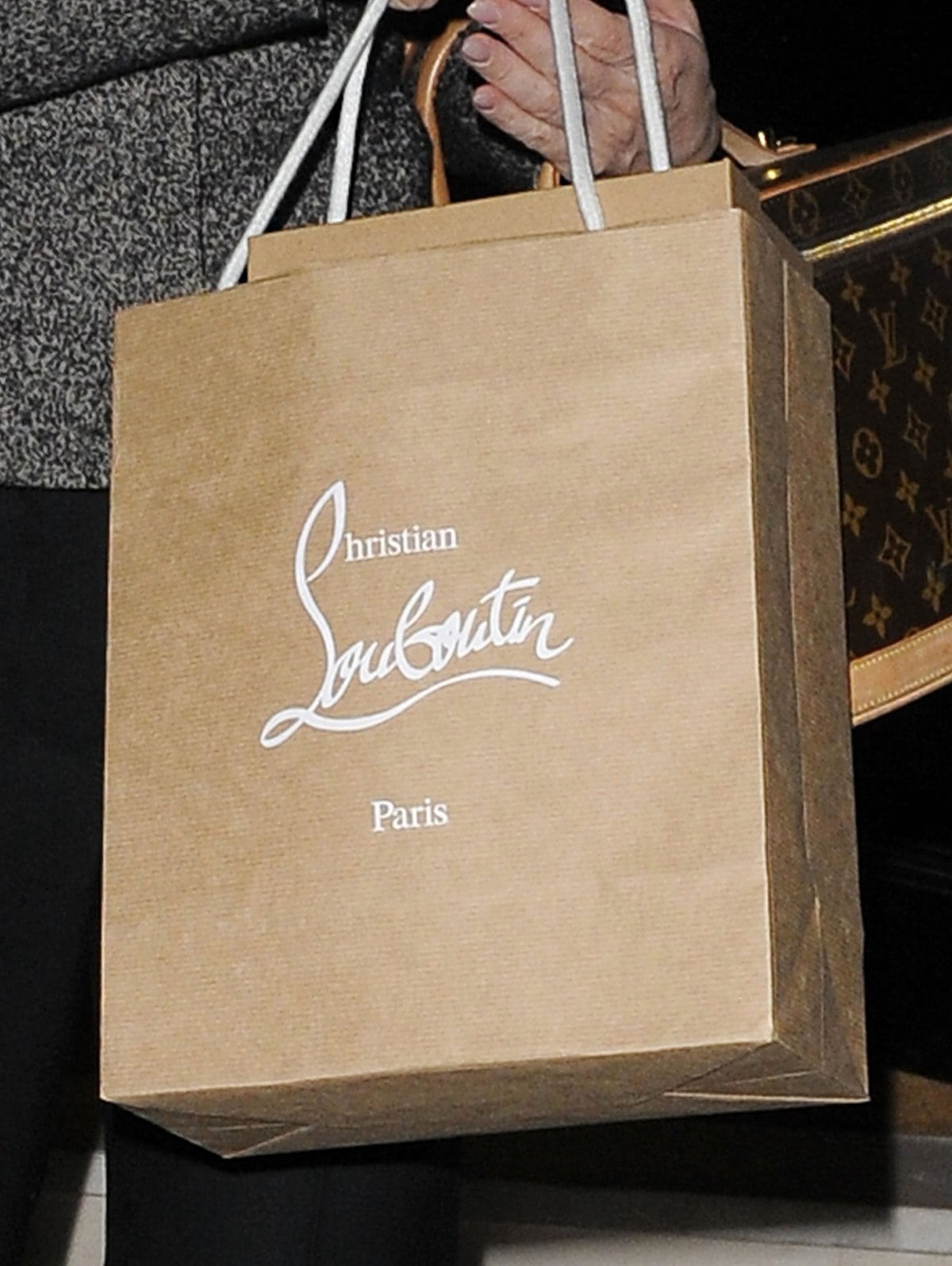 Kelly Brook spotted with a signature Christian Louboutin shopping bag, the ultimate symbol of Parisian luxury