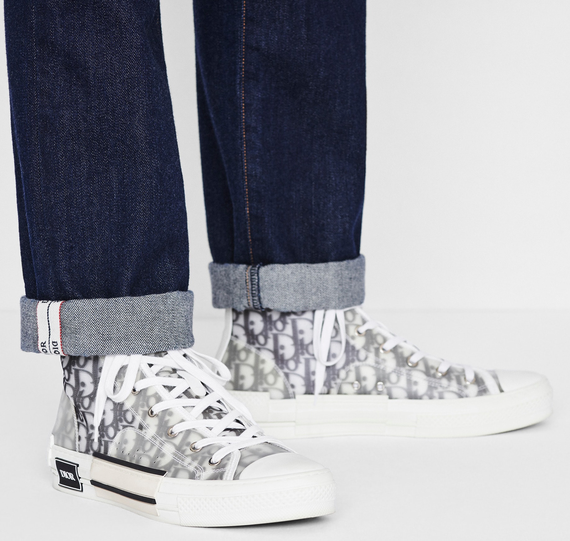 Dior's B23 high-top kicks feature the fashion house's infamous white and black Oblique motif and transparent paneling
